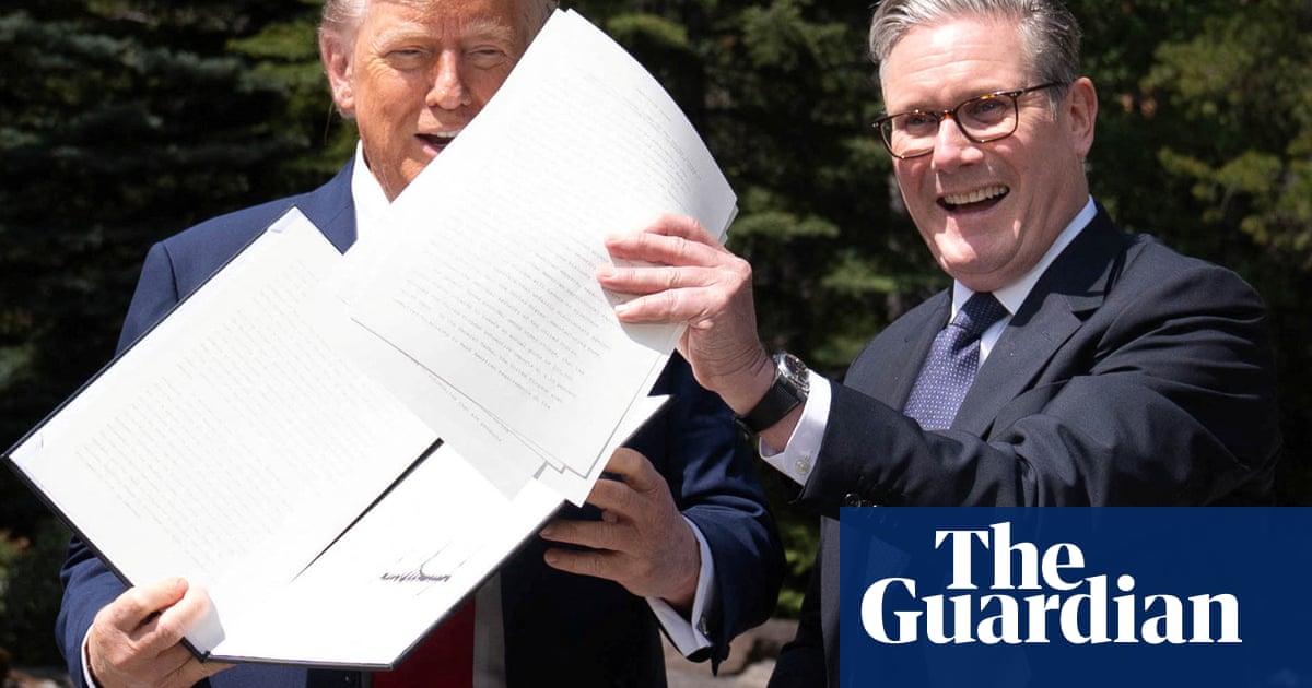Trump says UK is protected from tariffs ‘because I like them’ as trade deal is signed off | International trade | The Guardian